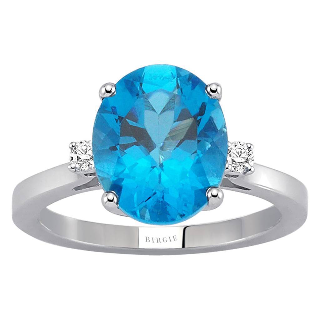 Bague diamant et topaze bleue ovale