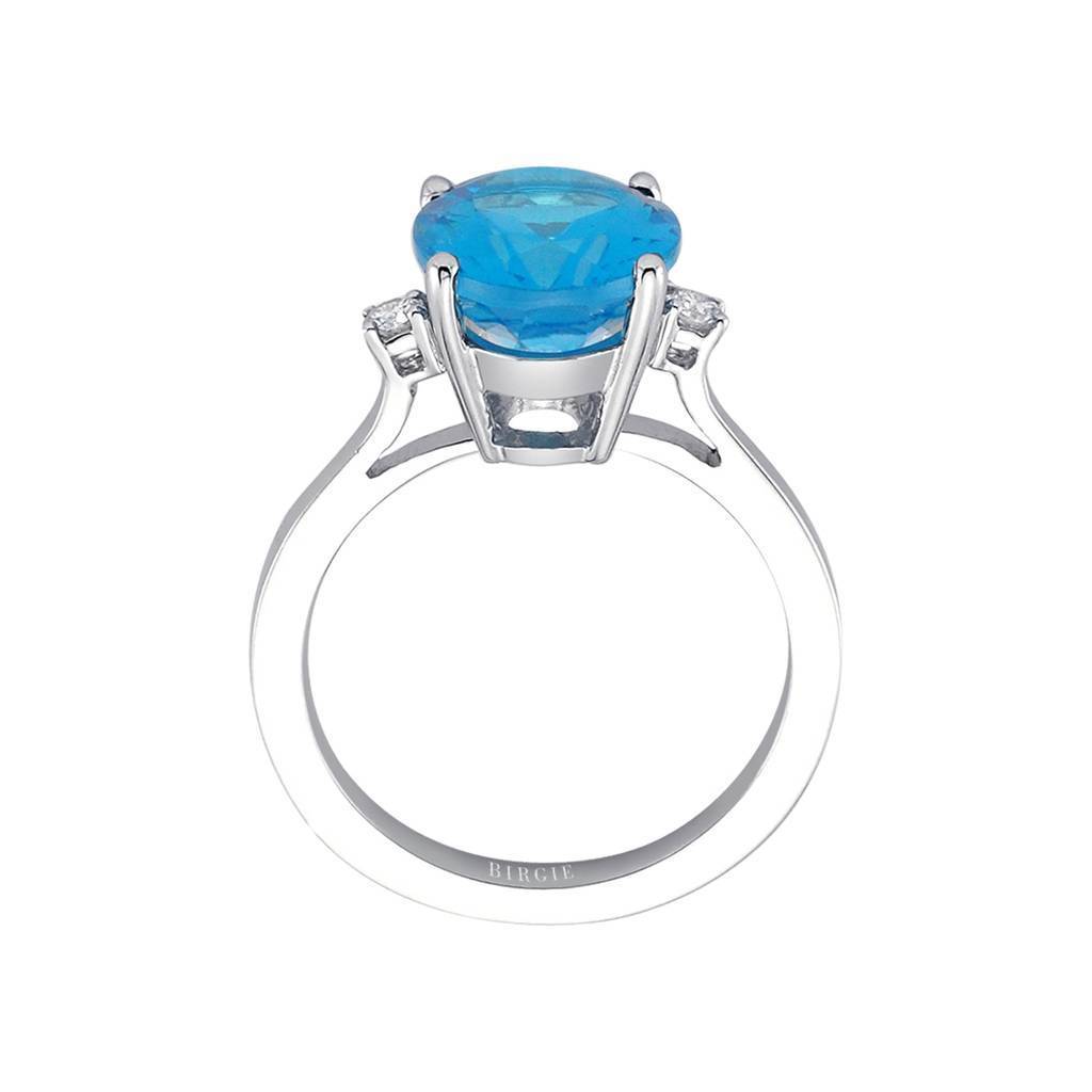 Bague diamant et topaze bleue ovale