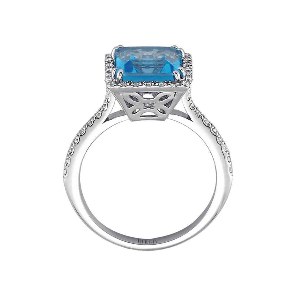 Bague diamant et topaze bleue princesse