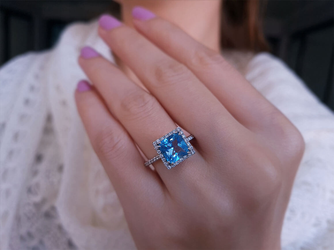 Bague diamant et topaze bleue princesse