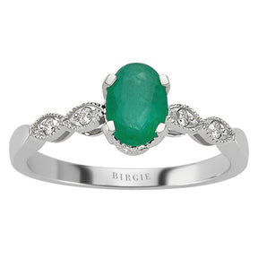 Oval Emerald and Single Prong Set Diamond Side Stones Ring