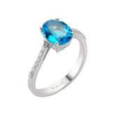 Diamond and Oval Cut Blue Topaz Ring